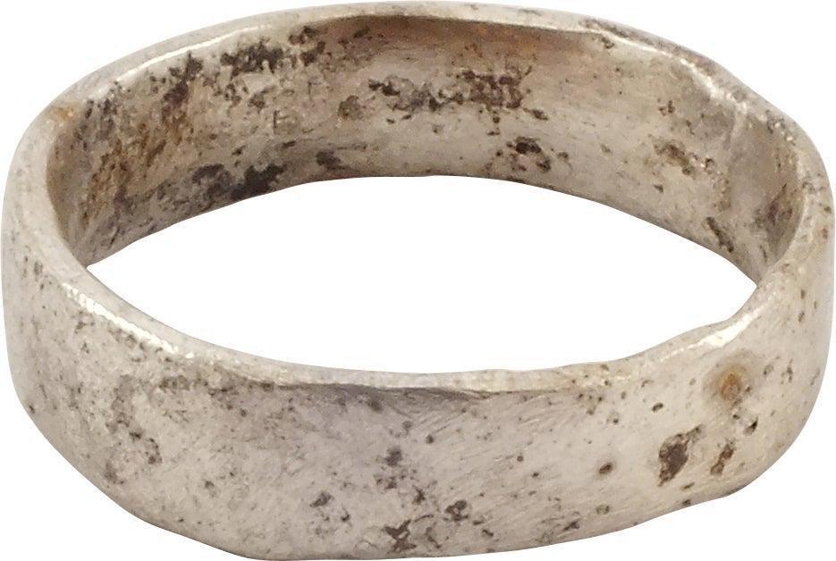 ANCIENT VIKING WARRIOR'S WEDDING RING, SIZE 9 3/4: 9th-11th century AD. Silvered bronze, size 9 3/4. Wide 5.7mm band with a low rounded face. Made with a core filling the inside which distributed the flowing metal and allowed for slower cooling. The c