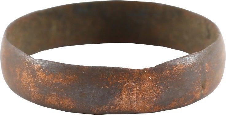 RARE COPPER VIKING RING, 900-1050 AD, SIZE 10: Size 10. 4.7mm width with low rounded face. Fine dark red/brown copper patina with minor encrustation from burial. Vikings were expert metallurgists. The use of pure copper is rare and suggests a supe