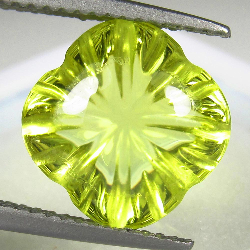 Natural Lemon Quartz - 5.41 Ct: No Reserve! Title: Natural Lemon Quartz - 5.41 Ct Origin: Africa Weight: 5.41 Size/Dimensions: 12 x 10.8 x 7.2 mm Additional Information: Pieces : 1 No's / Shape : Cushion Flower Cut / Color : Light Y