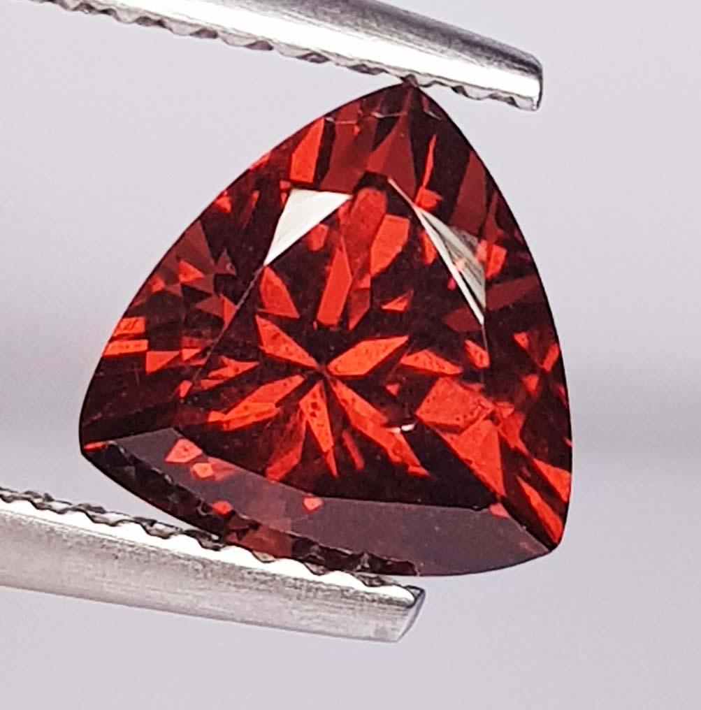 2.00 Ctz Natural Almandite Garnet: No Reserve! Title: 2.00 Ctz Natural Almandite Garnet Color/Clarity: Orange Red / VVS Gemstones: Garnet Carat Weights: 2 Size/Dimensions: 7.50 x 7.50 x 5.10 Additional Information: Trillion / Nigeria S