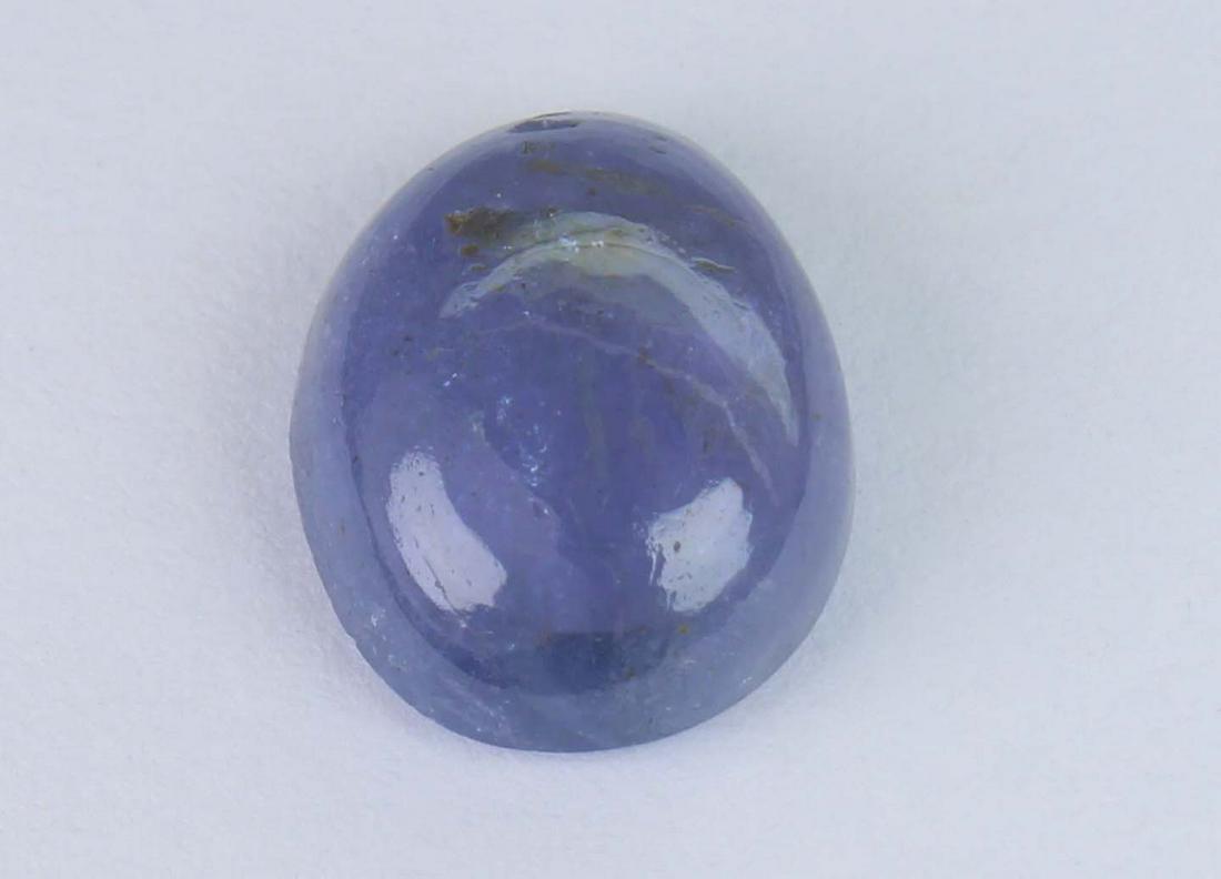 3.72 Cts Natural Tanzanite: No Reserve! Title: 3.72 Cts Natural Tanzanite Additional Information: Gemstone : Natural Tanzanite Shape and cut : Oval Cabochan Weight : 3.72 Carats Measurements :11x9 mm Color : Violet Transprancy :