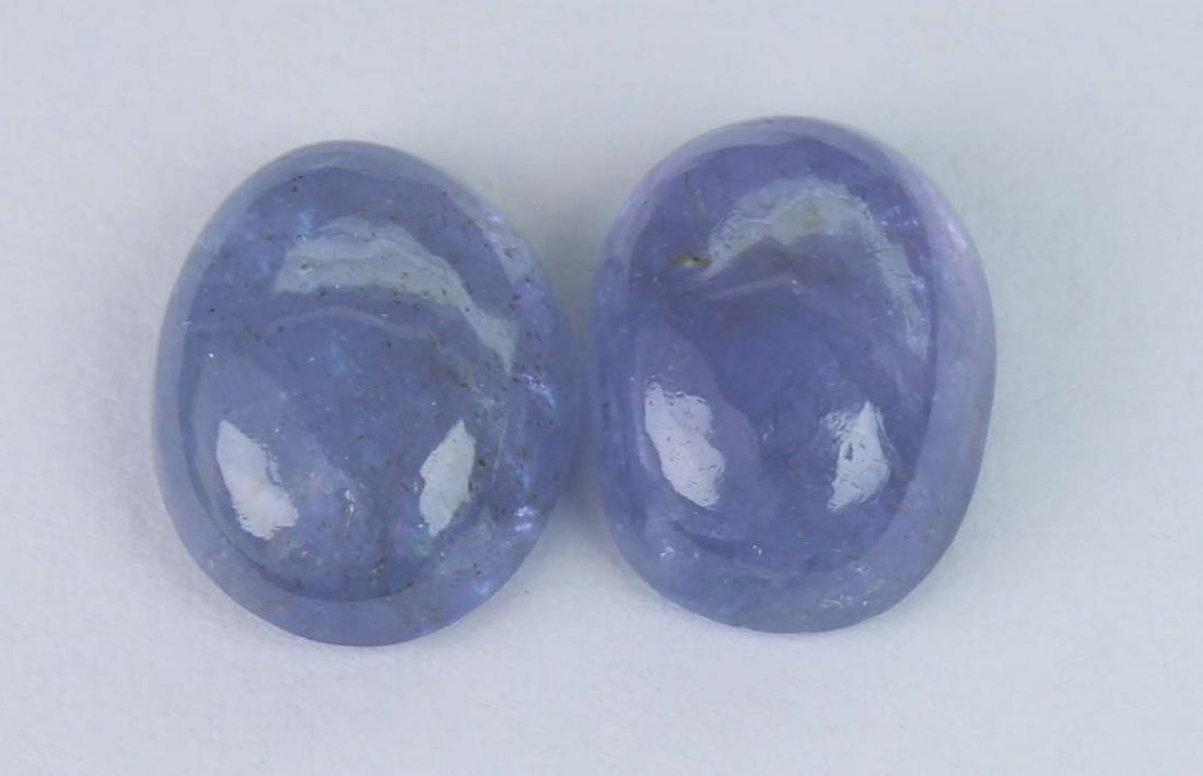 4.13 Cts Natural Tanzanite: No Reserve! Title: 4.13 Cts Natural Tanzanite Additional Information: Gemstone : Natural Tanzanite Shape and cut : Oval Cabochan Weight : 4.13 Carats Measurements : 9x7 mm Color : Violet Number Of Sto