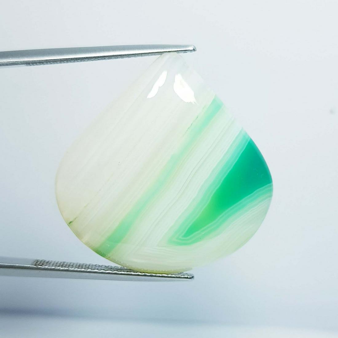 35.26 Ctz Natural Green Lace Agate: No Reserve! Title: 35.26 Ctz Natural Green Lace Agate Color/Clarity: Green / Transparent Gemstones: Agate 32.26 29.32 x 29.04 x 5.91 Additional Information: Pear / Bostwana Shipping: Domestic: Flat-ra