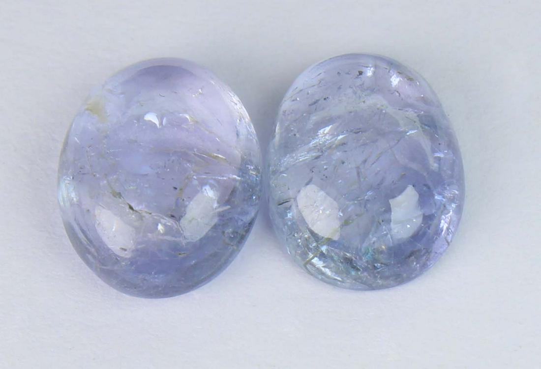 5.48 Cts Natural Tanzanite: No Reserve! Title: 5.48 Cts Natural Tanzanite Additional Information: Gemstone : Natural Tanzanite Shape and cut : Oval Cabochan Weight : 5.48 Carats Measurements : 10x8 mm , 9.89x7.64x3.49 mm Color :