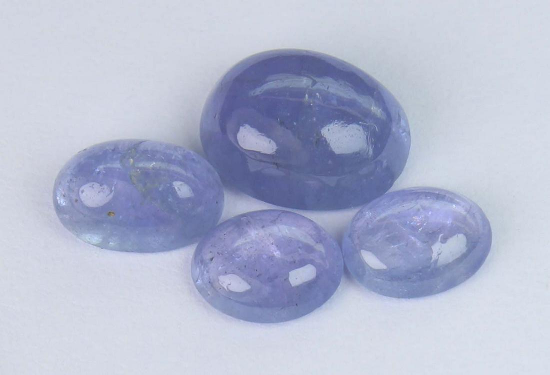 3.99 Cts Natural Tanzanite: No Reserve! Title: 3.99 Cts Natural Tanzanite Additional Information: Gemstone : Natural Tanzanite Shape and cut : Oval Cabochan Weight :3.99 Carats Measurements : 8.52x6.41x3.83mm - 6x5 mm Color : Vi
