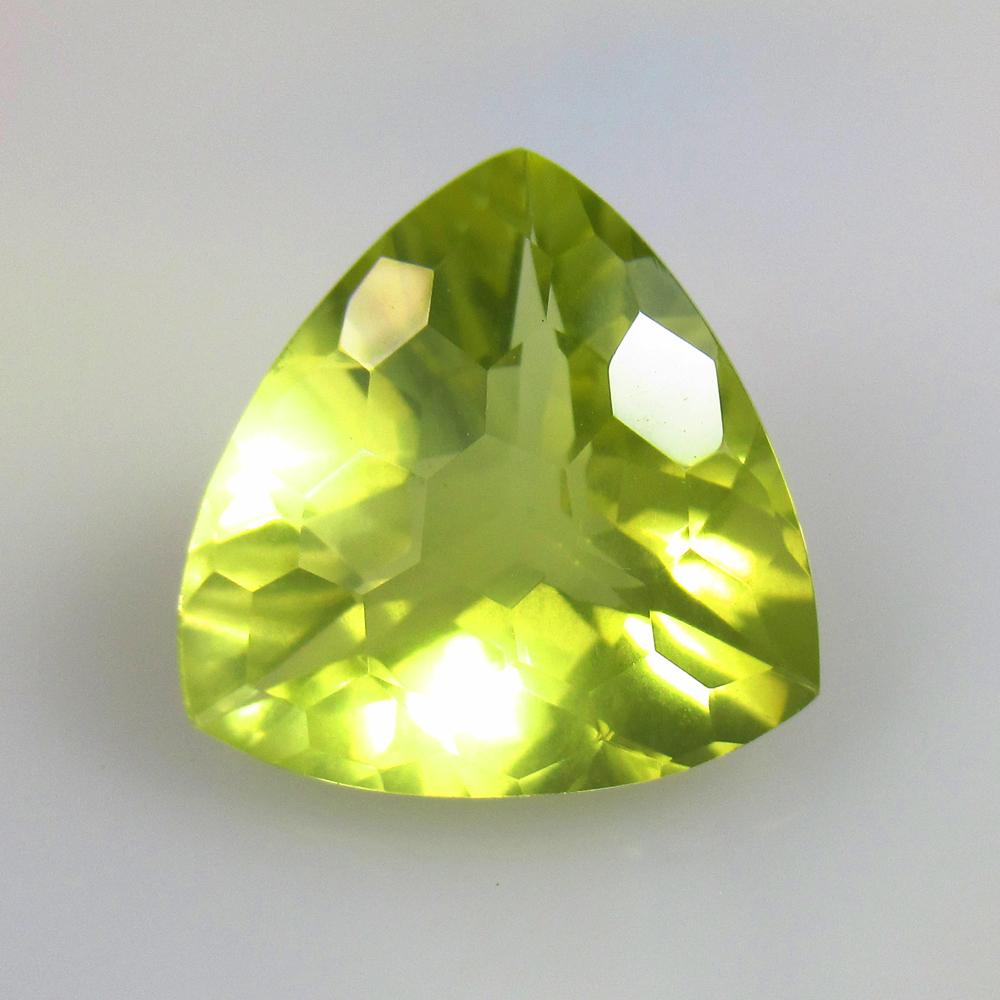 10.13 Ctw Natural Lemon Quartz Trillion Cut: No Reserve! Title: 10.13 Ctw Natural Lemon Quartz Trillion Cut Stone Clarity: VVS Gemstones: Natural Lemon Quartz Carat Weights: 10.13 Size/Dimensions: 16.00 x 15.30 x 9.00 mm Additional Information: 
