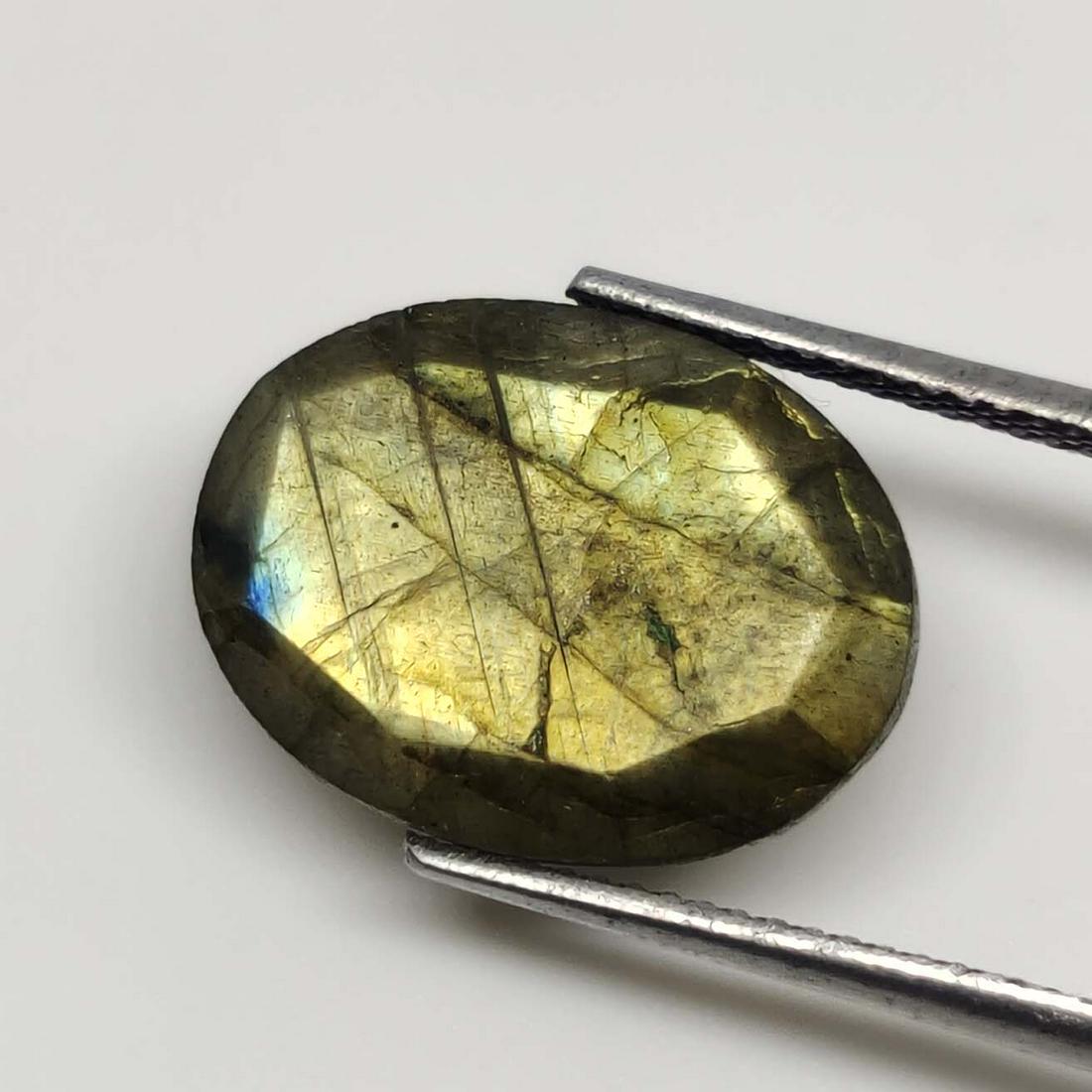 7.50 ct Natural Faceted Labradorite: No Reserve! Title: 7.50 ct Natural Faceted Labradorite Additional Information: Gemstones: Labradorite Carat Weights: 7.50 ct Size/Dimensions: 16 X 12 X 5 mm Origin : Labrador Materials & Techniques: L