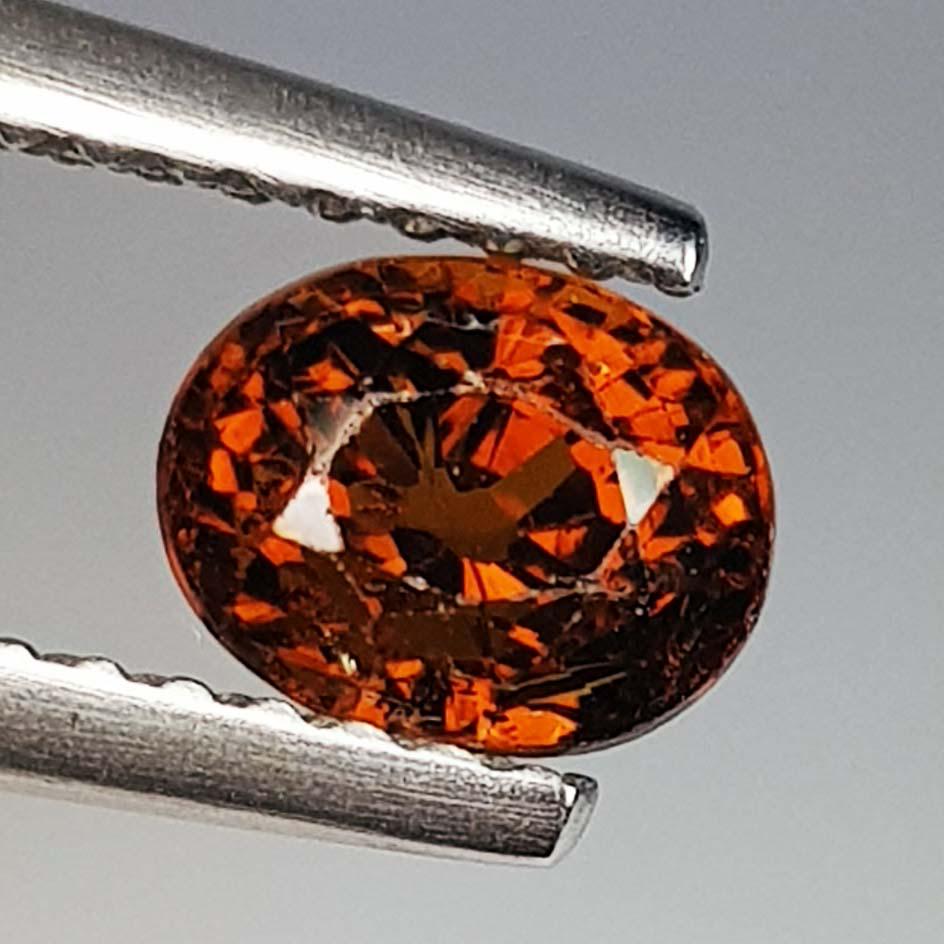 Natural Mali Garnet Oval Cut - 1.09 Ctz: No Reserve! Title: Natural Mali Garnet Oval Cut - 1.09 Ctz Color/Clarity: Orangish Brown / SI Gemstones: Mali Garnet 1.09 6.00 x 4.80 x 4.90 Additional Information: Oval - Mali Shipping: Domestic: Fla