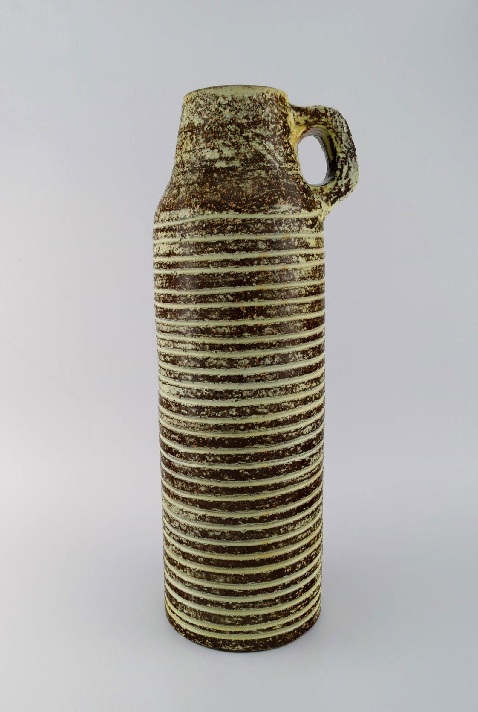 Ingrid Atterberg for Upsala-Ekeby. Large floor vase with grooved body and handle in glazed: Ingrid Atterberg for Upsala-Ekeby. Large floor vase with grooved body and handle in glazed stoneware. Scandinavian design, 1960s. Measures: 47 x 15.5 cm. In excellent condition. Stamped. Reserve: $413