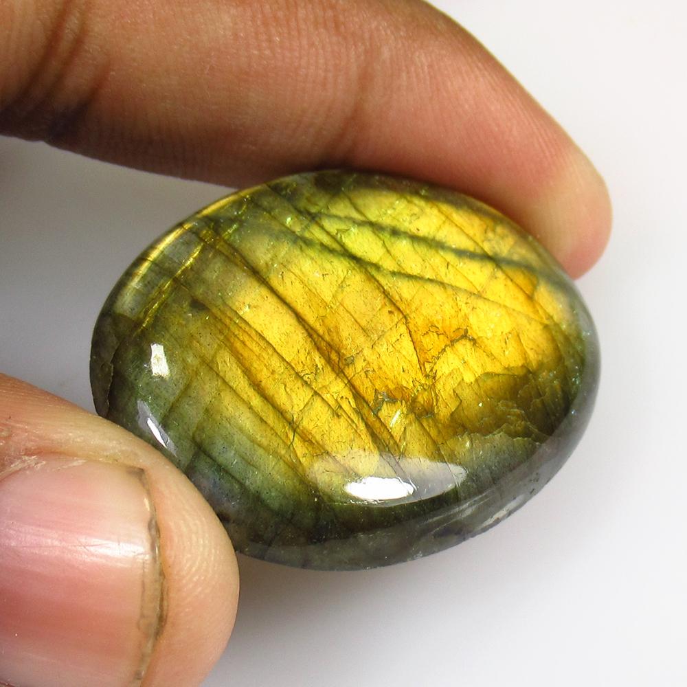 44.27 Ctw Natural Labradorite Oval Cab: Title: 44.27 Ctw Natural Labradorite Oval Cab Stone/Clarity: Semi-Transparent Gemstone: Natural Labradorite Carat Weight: 44.27 Size/Dimension: 39.00 x 29.00 x 5.50 mm Additional Information: Nice Ova