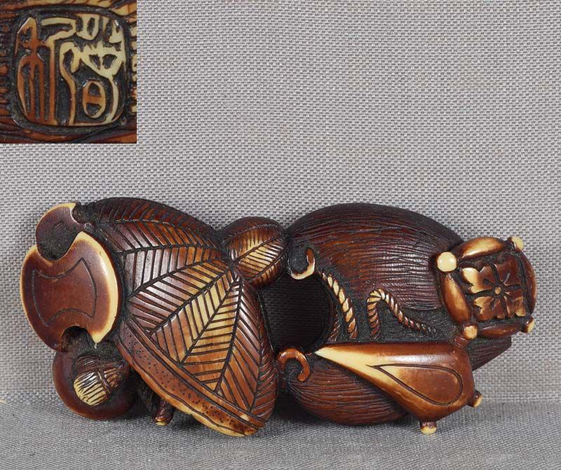 19c netsuke TAKARAMONO treasures by HARUTOSHI: 19th century netsuke depicting Takaramono - a group of objects, each endowed with an emblematic meaning: Kakuregasa (the hat of invisibility), Kakure Mino (lucky rain coat protecting against evil spir