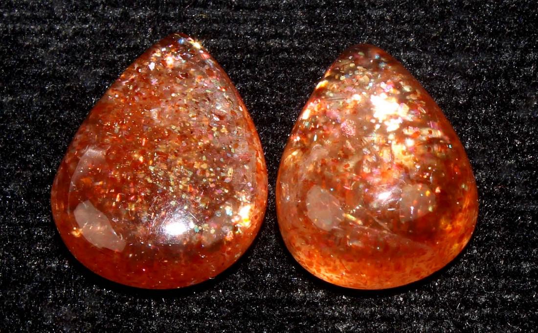 7.94 Cts Natural Sunstone Lot: No Reserve! Gemstone : Natural Sunstone Origin : Africa Weight : 7.94 Carats Dimensions : 12.65x9.76x5.10 mm , 13.36x10.453.75 mm Shape : Pear Cabochon Color : Orange Number Of Stone : 2 Treatment : N