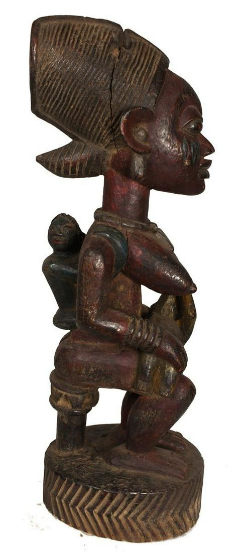 Maternity figure - Wood - Yoruba - Nigeria: Beautiful wooden maternity figure from the Yoruba tribe of Nigeria. Exhibiting a wide diversity in size, symbolism, intimacy and style. African maternity figures depict the ideals of beauty, fertility