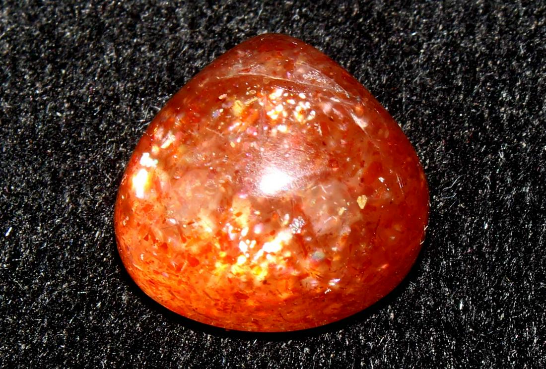 7.50 Cts Natural Sunstone: No Reserve! Title: 7.50 Cts Natural Sunstone Description: Gemstone : Natural Sunstone Origin : Africa Weight : 7.50 Carats Dimensions : 12.27x11.70x7.45 mm Shape : Pear Cabochon Color : Orange Treatme