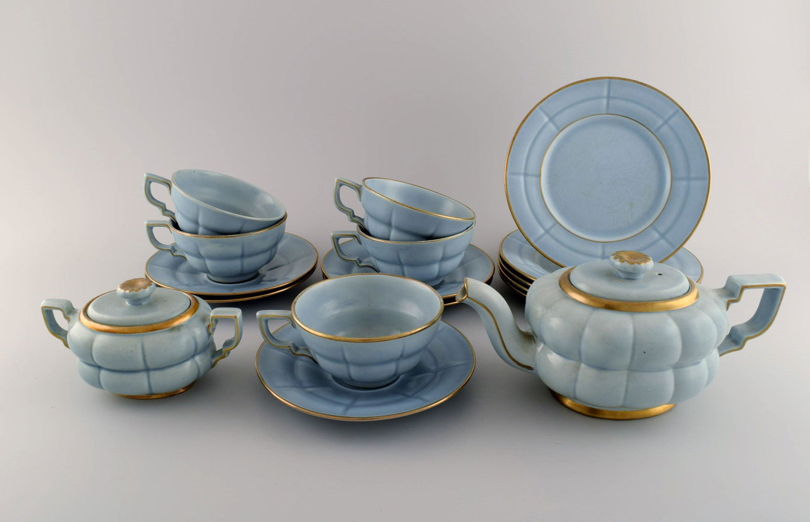 Arthur Percy for Upsala-Ekeby / Gefle. Complete art deco Grand tea service in pastel blue porcelain: Arthur Percy for Upsala-Ekeby / Gefle. Complete art deco Grand tea service in pastel blue porcelain with hand-painted gold edge for five people. 1930s / 40s. Consisting of five teacups with saucers, f