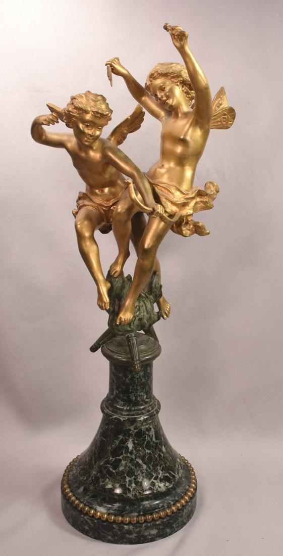 Beautiful Antique Gilt Bronze 2 Cherubs With Bow and Arrow: Beautiful Antique Gilt Bronze Cherubs with Bow and Arrow on Marble base. The two cherubs are dancing on bronze torches. One has just shot his arrow the other is holding two parts of an arrow in the ai