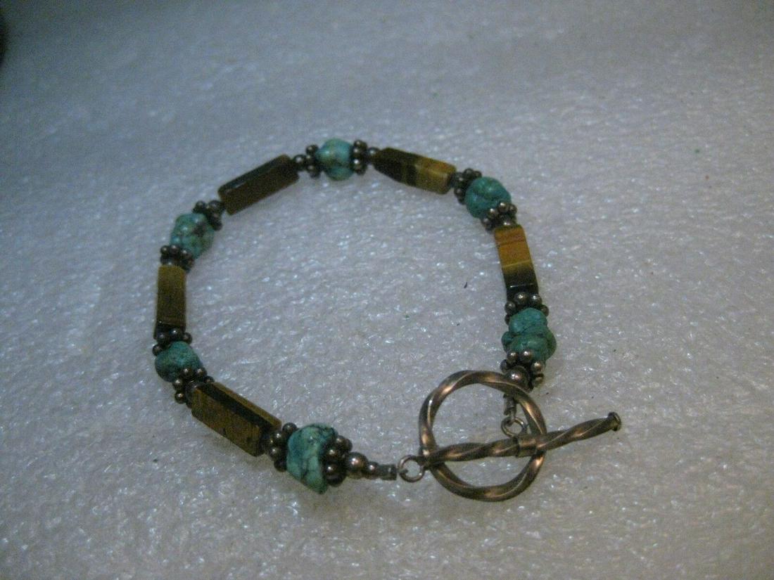 Sterling Southwestern Tiger's Eye & Turquoise Bracelet, Toggle Clasp, 7.5": Vintage Southwestern Tiger's Eye and Turquoise beaded bracelet with sterling silver toggle clasp - did not test fluted beads. This has natural tiger's eye square tube beads that are about 2/3" long -