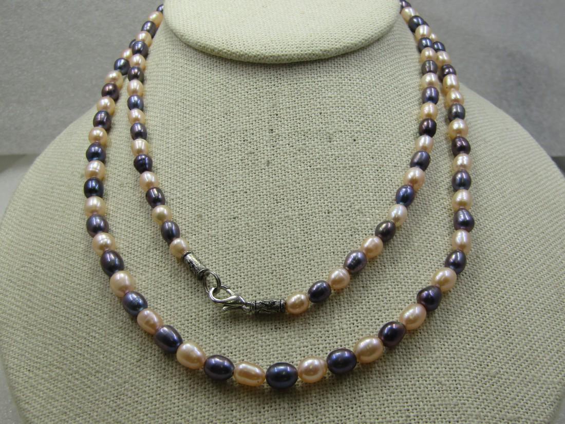 Pink & Gunmetal Blue Tahitian Cultured Pearl Necklace, 32": Pink & Gunmetal Blue Tahitian Cultured Pearl Necklace, 32". The pearls are a baroque style with shapes silghtly irregular in a shimmery gunmetal blue and pink in appx. 5.5mm to 6.5mm long and appx. 5m