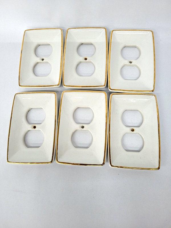 Vintage Receptacle Socket Ceramic Cover White and Gold Set of 6: Vintage from the 1970s Materials: brass, enamel Description Vintage Plug In Receptacle Socket Ceramic Cover White and Gold 4.75"H x 3.25"W x .5"D Towne Brand Set of 6 No chips or cracks Reserve: $59.0