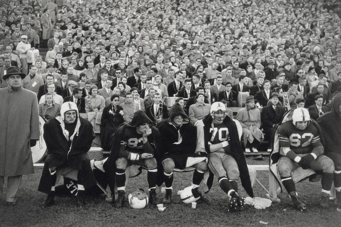 BRUCE DAVIDSON - Yale Football, 1954: Artist: Bruce Davidson Title: Yale Football, 1954 Medium: Photo Litho, 2009, Germany Dimensions: 9.6x6.4" Description: Heat Wax Mounted on 8.5x11" Conservation Board Artist Bio: Bruce Davidson is an A