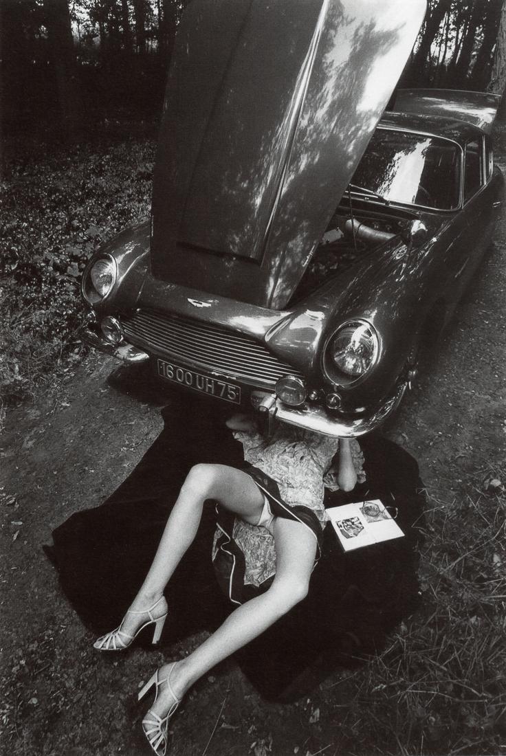 JEANLOUP SIEFF - Under the Car: Artist: Jeanloup Sieff Title: Under the Car Medium: Duotone Photo Litho, 1977, Italy Dimensions: 5.95x8.8" Description: Heat Wax Mounted on 8.5x11" Conservation Board Artist Bio: Jeanloup Sieff (1933-