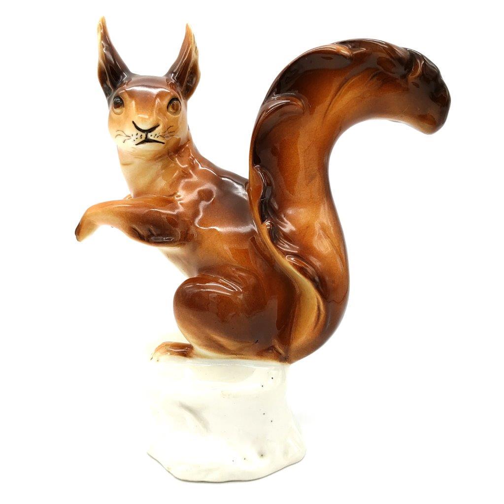 Royal Dux - Squirrel: Title: Royal Dux - Squirrel Date/Period: 1953-1992 Dimension: height 25 cm Materials: porcelain with glaze Provenance: Squirrel, porcelain with glaze, decorated with enamel colours, model number 359 R