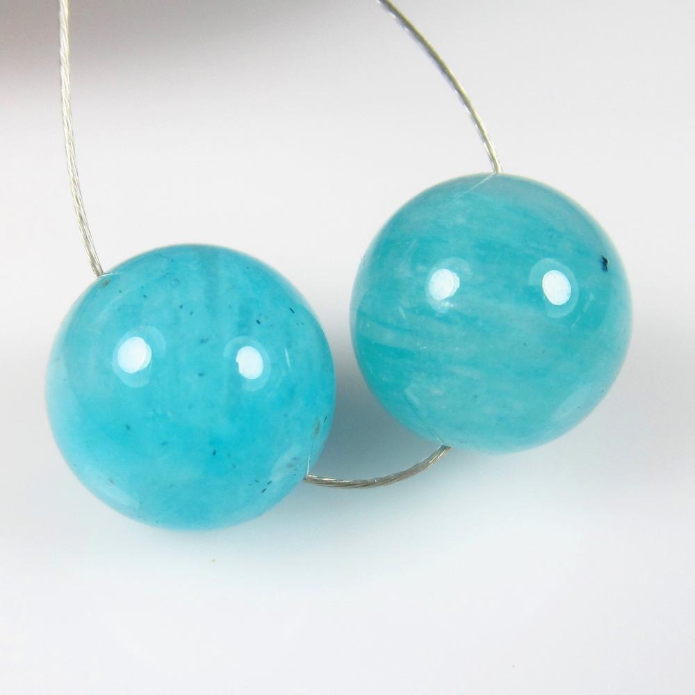Natural Amazonite Beads - 10.52 Ct: No Reserve! Title: Natural Amazonite Beads - 10.52 Ct Origin: Brazil Weight: 10.52 Size/Dimensions: 10.0 x 10.0 mm Additional Information: Pieces : 2 No's / Shape : Round Drilled / Color : Blue / Clar