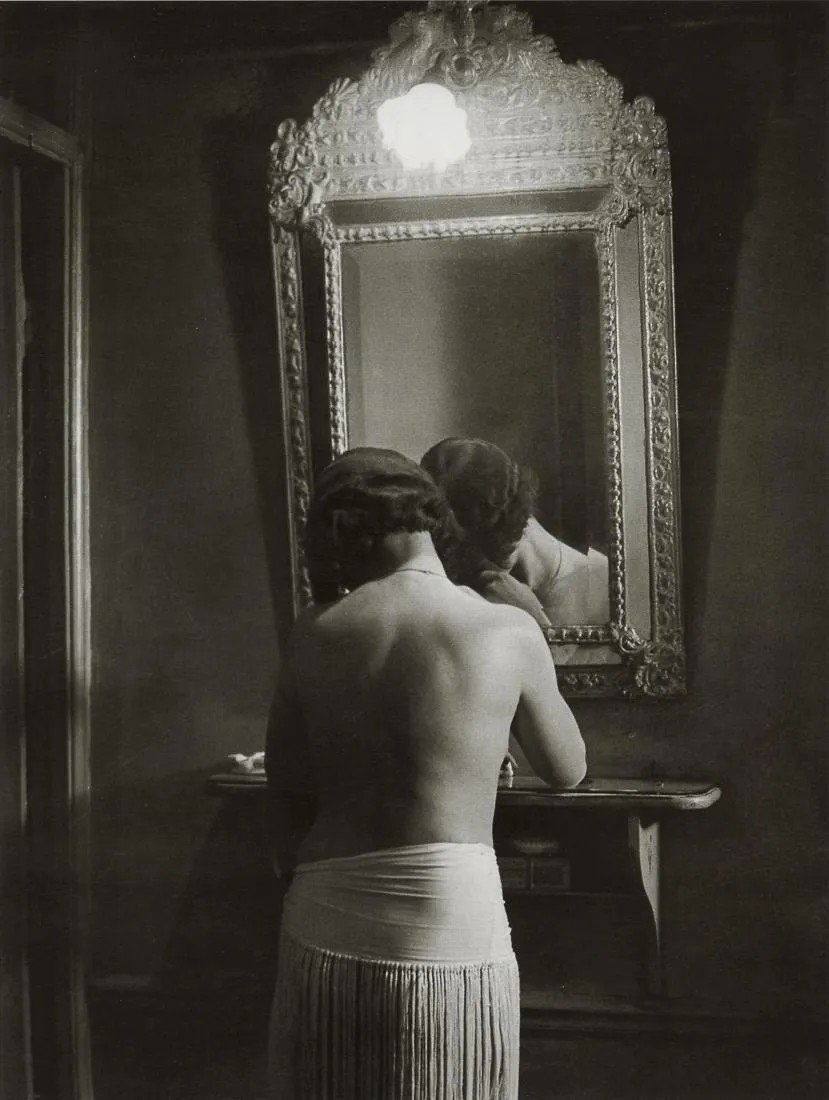 BRASSAI - At Suzy's, 1932: Artist: Brassai Title: At Suzy's, 1932 Medium: Photo Litho, 2000, Italy Dimensions: 7.5x9.95" Description: Heat Wax Mounted on 11x14" Conservation Board Artist Bio: Brassai was a Hungarian-French phot