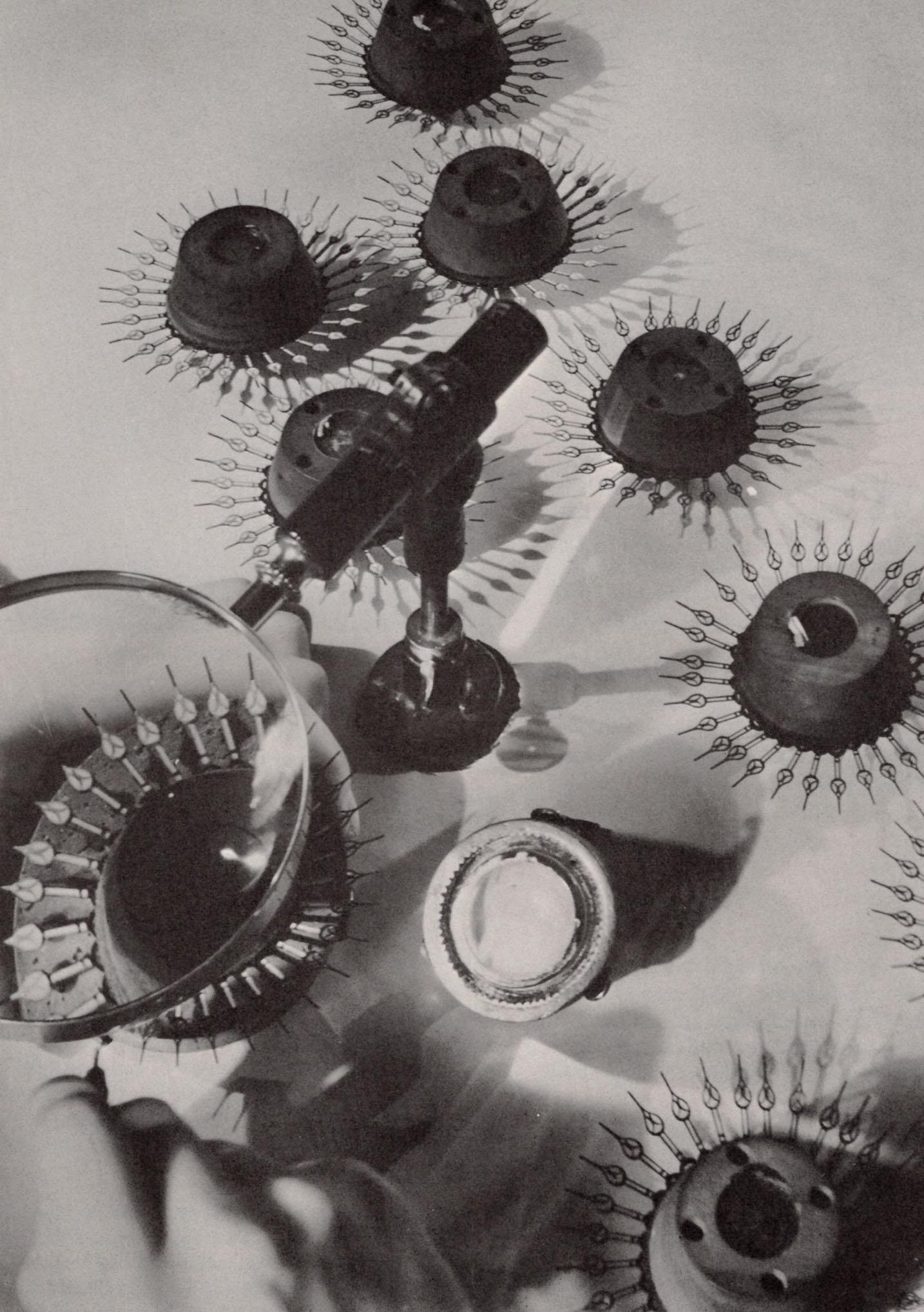 MARGARET BOURKE WHITE - Watch hands in Elgin, Fortune, 1930: Artist: MARGARET BOURKE WHITE Print Title: Watch hands in Elgin, Fortune, 1930 Printing Date: 1970’s Medium: Authentic vintage Photoengraving Printed in: the US Image Size approx: 8.5 x 5.75R
