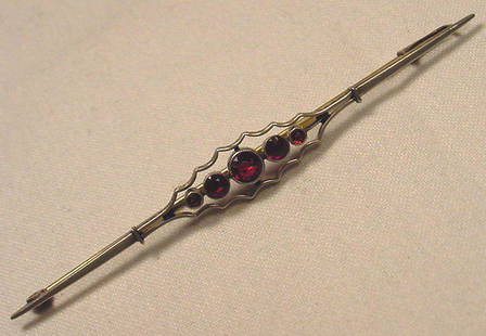 Large Antique Garnet & Gold Art Deco Brooch: Title: Large Antique Garnet & Gold Art Deco Brooch Additional Information: Rare antique white and yellow gold Art Deco garnet brooch. This is a large one measuring over 3 1/2 inches long. Height 7/16