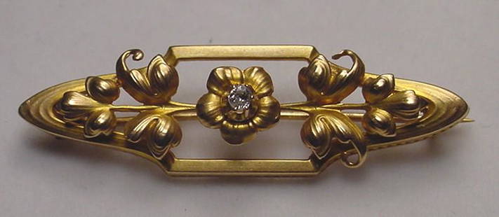 Beautiful Art Nouveau 18K Diamond Flower Pin: Title: Beautiful Art Nouveau 18K Diamond Flower Pin Additional Information: Beautiful antique 18K gold and diamond Art Nouveau flower pin. The pin is centered with an old mine cut diamond measuring 8