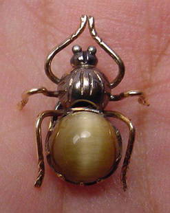Antique Cat's Eye Gold And Silver Inset Lapel Pin: Title: Antique Cat's Eye Gold And Silver Inset Lapel Pin Additional Information: Beautiful and very rare antique Cat's Eye gold and silver inset lapel pin. The back has a string like circle where one