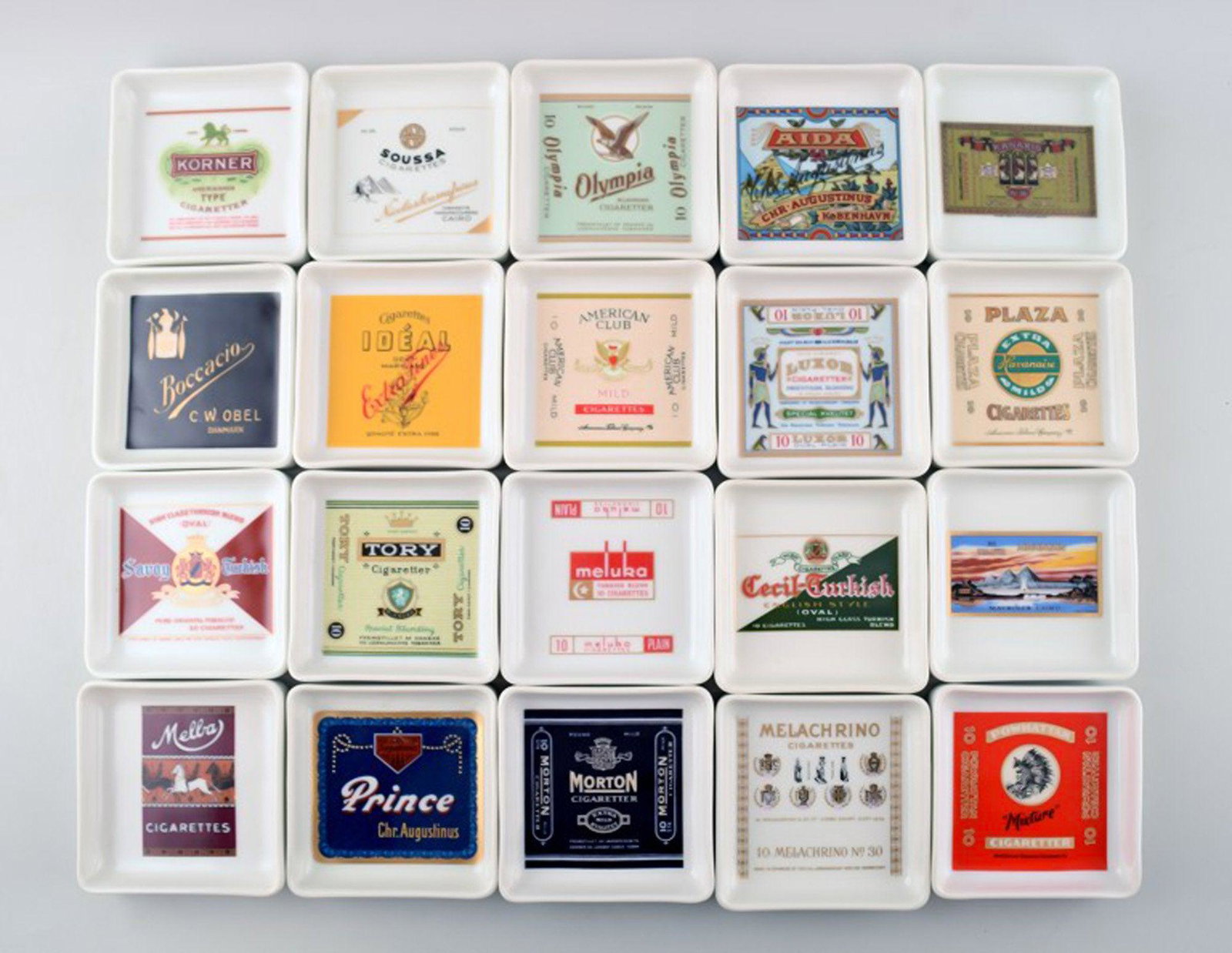 Large collection of b&g, Bing & Grondahl, 20 ashtrays with different brand of cigarettes motives.: Large collection of b&g, Bing & Grondahl, 20 ashtrays with different brand of cigarettes motives. Original packaging. In perfect condition. 1st. factory quality. Measures 9 x 2 cm. The price is per pi