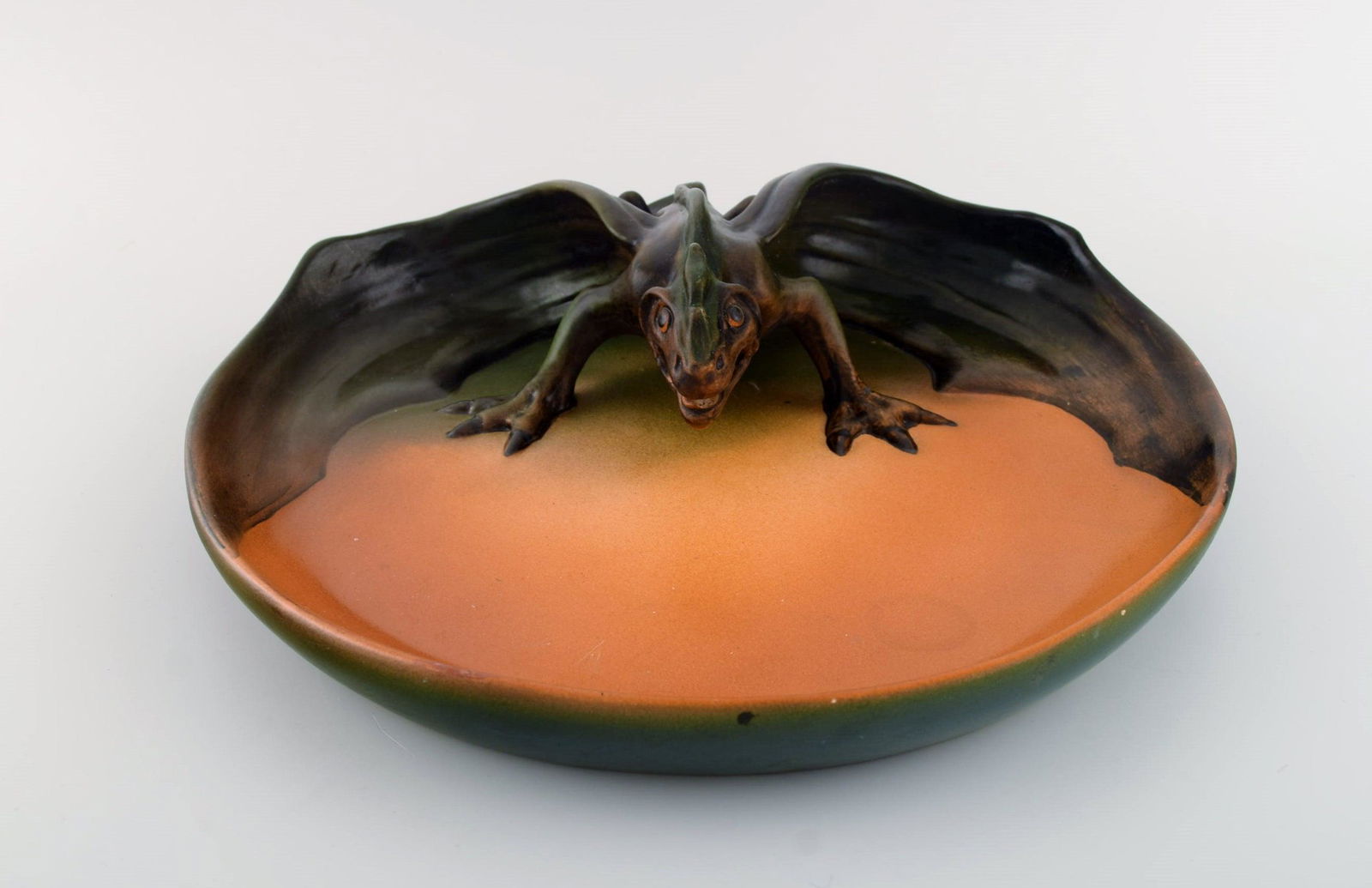 Ipsen's, Denmark. Rare dish with dragon in hand-painted glazed ceramics. Approx. 1920 (1 of 6)