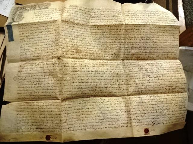 1729 English Vellum Indenture Red Wax Seals: Large English vellum indenture dated 1729 during the reign of George II being the conveyance by lease of property in Helpringham in the county of Lincoln. Nicely penned with blue revenue stamps, tax s