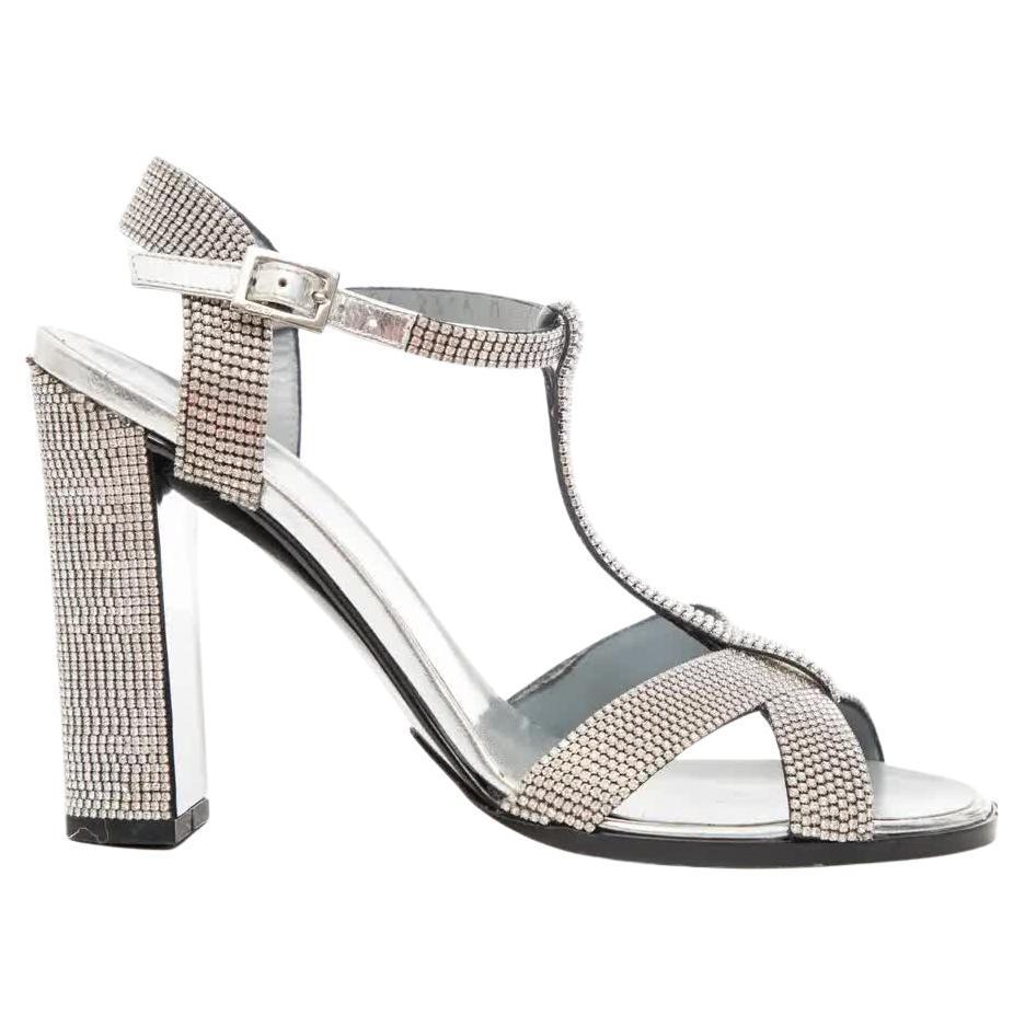 Tom Ford For Gucci Runway Metallic Silver Crystal T-Strap Sandals, Spring 2000: Tom Ford for Gucci, Spring-Summer 2000 metallic silver leather T-strap sandals with strass crystal embellishments throughout, covered heels and buckle closure at ankle straps. Original Size: EU 38, UK