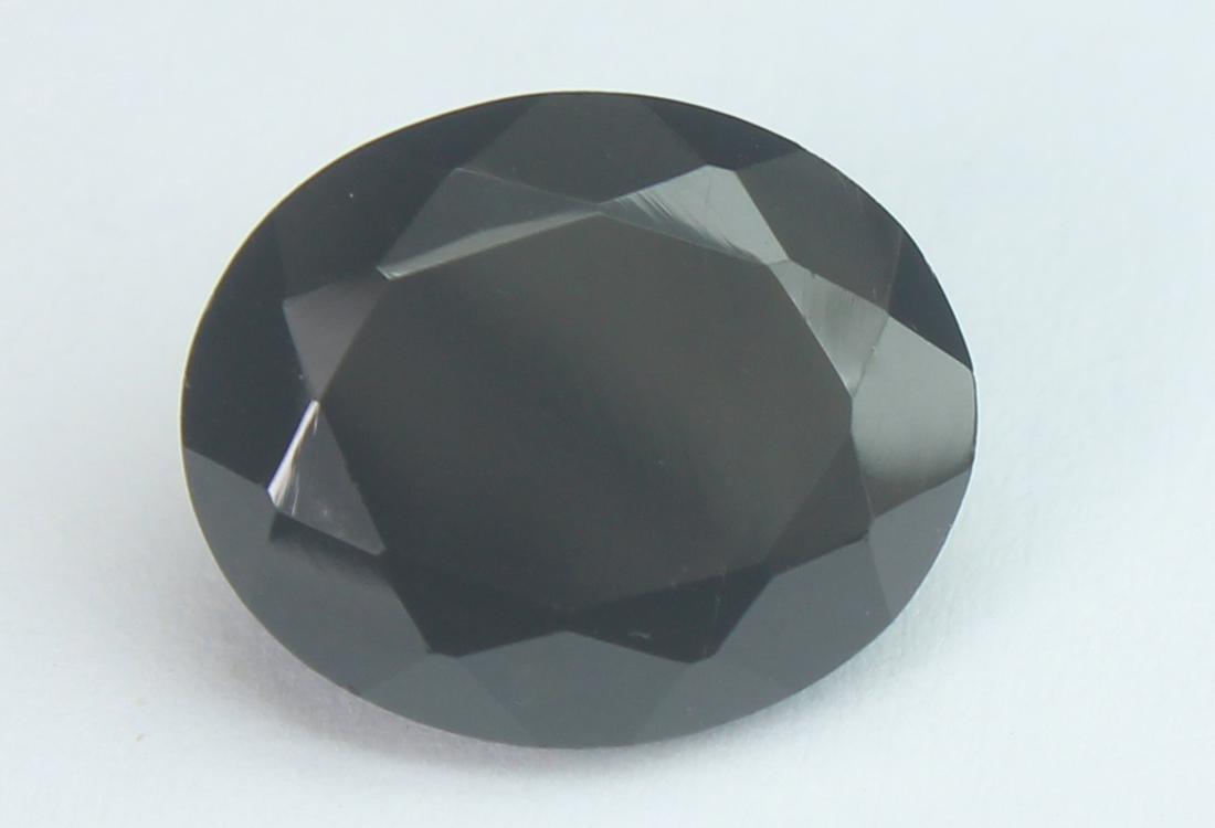 5.59 Cts Natural Black Spinel: No Reserve! Title: 5.59 Cts Natural Black Spinel Additional Information: Gemstone : Natural Black Spinel Shape and cut : Oval Cut Origin : Africa Weight : 5.59 carats Measurements : 12x10 mm , Color :