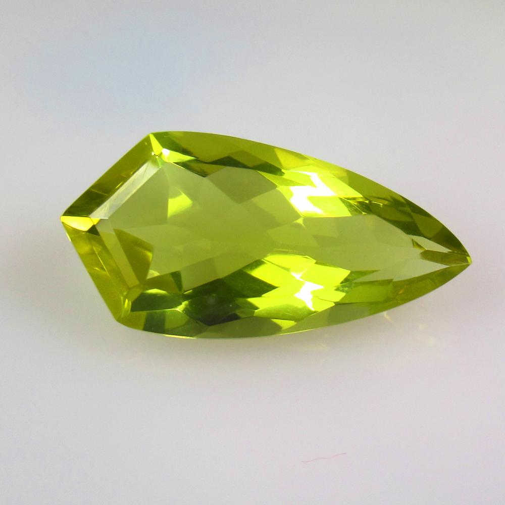 12.88 Ctw Natural Lemon Quartz Fancy Cut: No Reserve! Title: 12.88 Ctw Natural Lemon Quartz Fancy Cut Stone Clarity: VVS Gemstones: Natural Lemon Quartz Carat Weights: 12.88 Size/Dimensions: 25.00 x 12.50 x 9.00 mm Additional Information: Goo