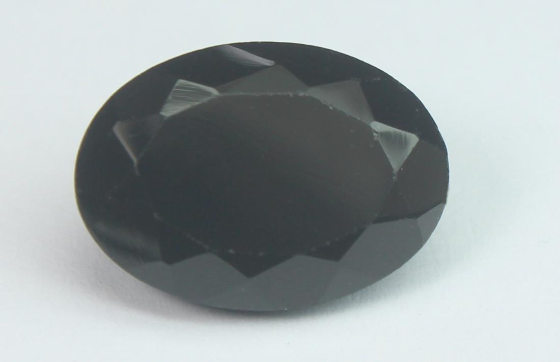 6.86 Cts Natural Black Spinel: No Reserve! Title: 6.86 Cts Natural Black Spinel Additional Information: Gemstone : Natural Black Spinel Shape and cut : Oval Cut Origin : Africa Weight : 6.86 carats Measurements : 14x10 mm , Color :