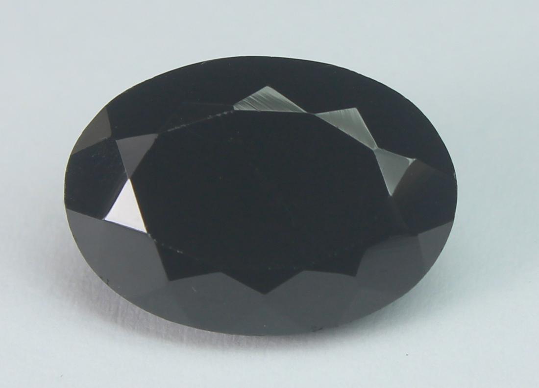 7.19 Cts Natural Black Spinel: No Reserve! Title: 7.19 Cts Natural Black Spinel Additional Information: Gemstone : Natural Black Spinel Shape and cut : Oval Cut Origin : Africa Weight : 7.19 carats Measurements : 14x10 mm , Color :
