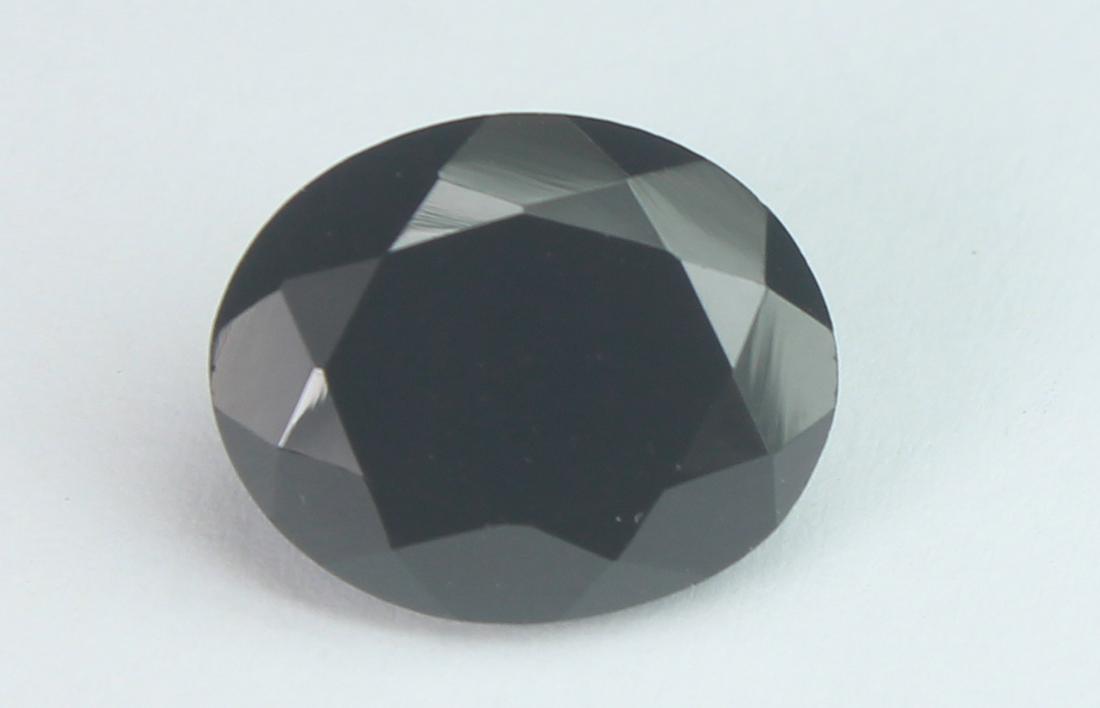 5.91 Cts Natural Black Spinel: No Reserve! Title: 5.91 Cts Natural Black Spinel Additional Information: Gemstone : Natural Black Spinel Shape and cut : Oval Cut Origin : Africa Weight : 5.91 carats Measurements : 12x10 mm , Color :