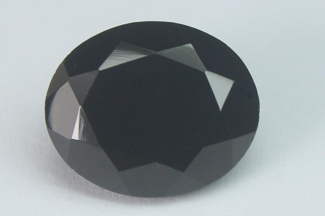 5.77 Cts Natural Black Spinel: No Reserve! Title: 5.77 Cts Natural Black Spinel Additional Information: Gemstone : Natural Black Spinel Shape and cut : Oval Cut Origin : Africa Weight : 5.77 carats Measurements : 12x10 mm , Color :