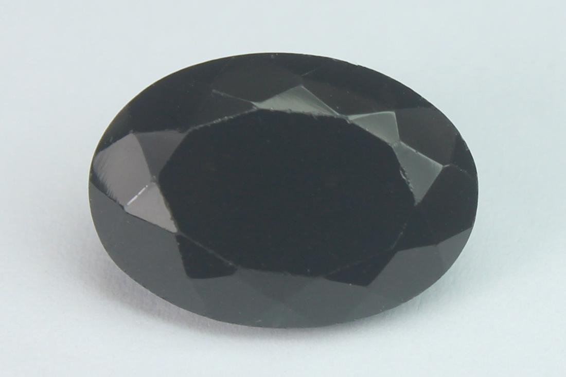 6.97 Cts Natural Black Spinel: No Reserve! Title: 6.97 Cts Natural Black Spinel Additional Information: Gemstone : Natural Black Spinel Shape and cut : Oval Cut Origin : Africa Weight : 6.97 carats Measurements : 14x10 mm , Color :