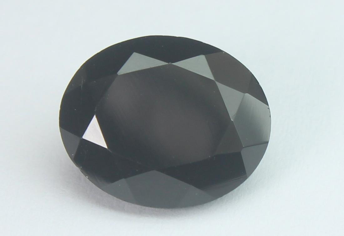 6.60 Cts Natural Black Spinel: No Reserve! Title: 6.60 Cts Natural Black Spinel Additional Information: Gemstone : Natural Black Spinel Shape and cut : Oval Cut Origin : Africa Weight : 6.60 carats Measurements : 14x10 mm , Color :