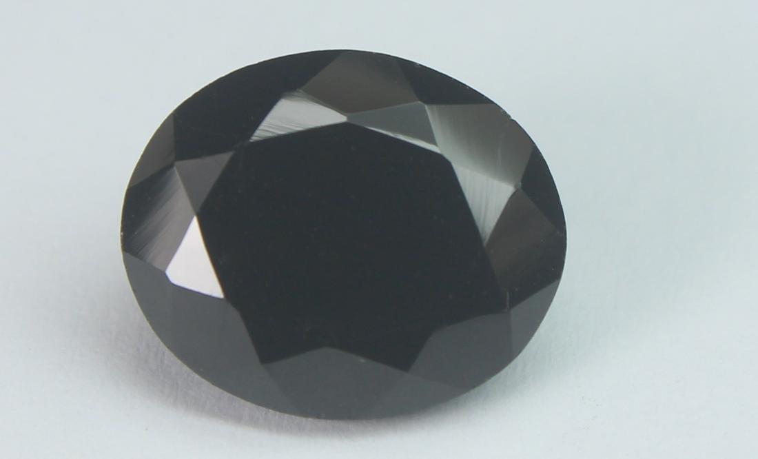 5.86 Cts Natural Black Spinel: No Reserve! Title: 5.86 Cts Natural Black Spinel Additional Information: Gemstone : Natural Black Spinel Shape and cut : Oval Cut Origin : Africa Weight : 5.86 carats Measurements : 12x10 mm , Color :