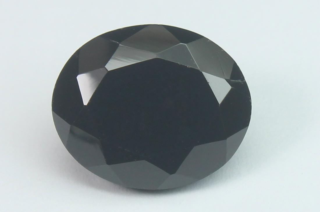 6.26 Cts Natural Black Spinel: No Reserve! Title: 6.26 Cts Natural Black Spinel Additional Information: Gemstone : Natural Black Spinel Shape and cut : Oval Cut Origin : Africa Weight : 6.26 carats Measurements : 12x10 mm , Color :