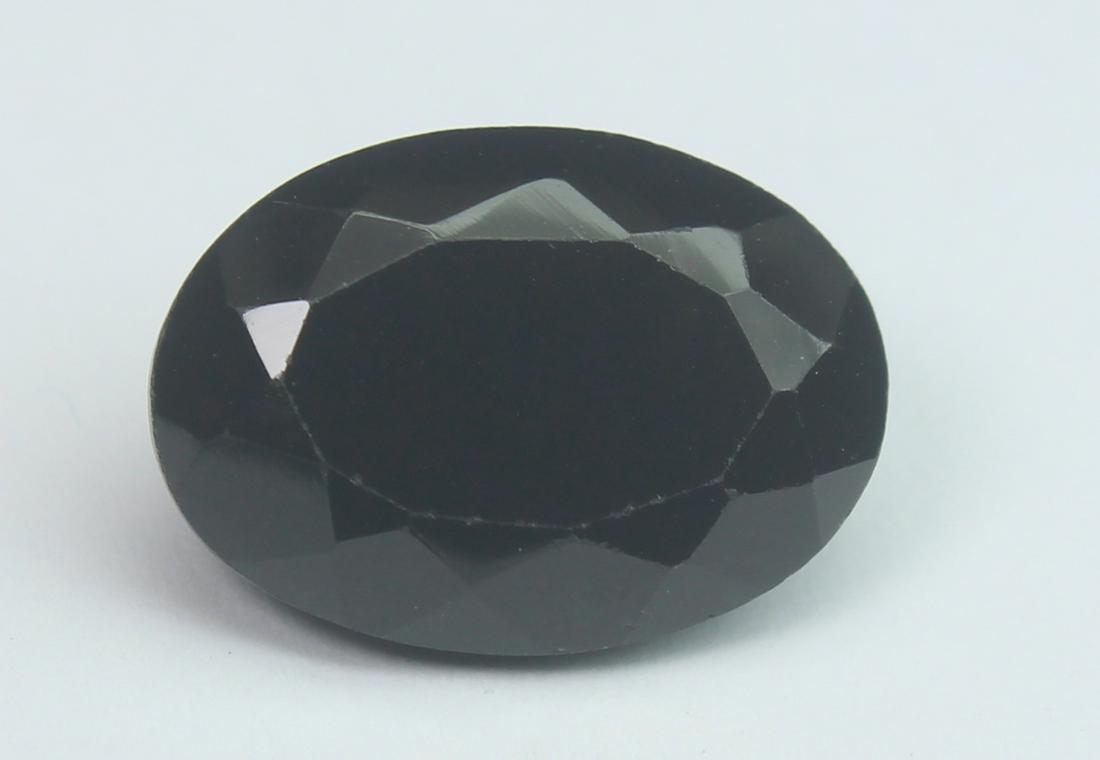 6.79 Cts Natural Black Spinel: No Reserve! Title: 6.79 Cts Natural Black Spinel Additional Information: Gemstone : Natural Black Spinel Shape and cut : Oval Cut Origin : Africa Weight : 6.79 carats Measurements : 14x10 mm , Color :