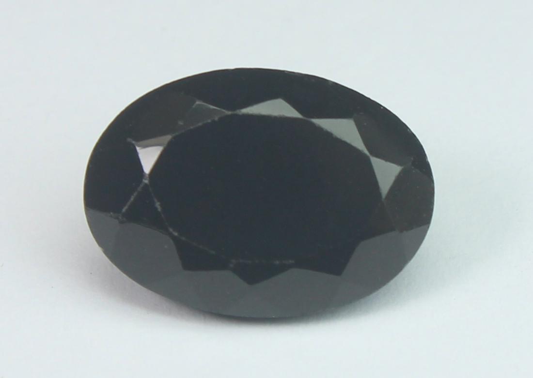 6.68 Cts Natural Black Spinel: No Reserve! Title: 6.68 Cts Natural Black Spinel Additional Information: Gemstone : Natural Black Spinel Shape and cut : Oval Cut Origin : Africa Weight : 6.68 carats Measurements : 14x10 mm , Color :