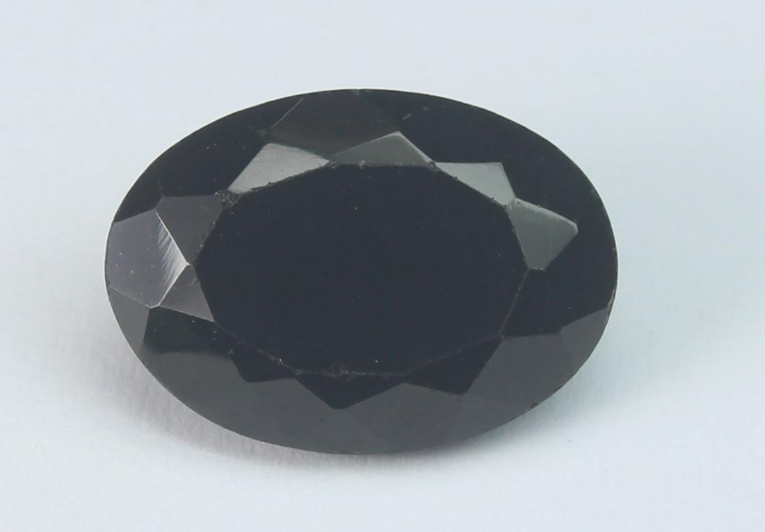 6.04 Cts Natural Black Spinel: No Reserve! Title: 6.04 Cts Natural Black Spinel Additional Information: Gemstone : Natural Black Spinel Shape and cut : Oval Cut Origin :Africa Weight : 6.04 carats Measurements : 14x10 mm Color : Bl