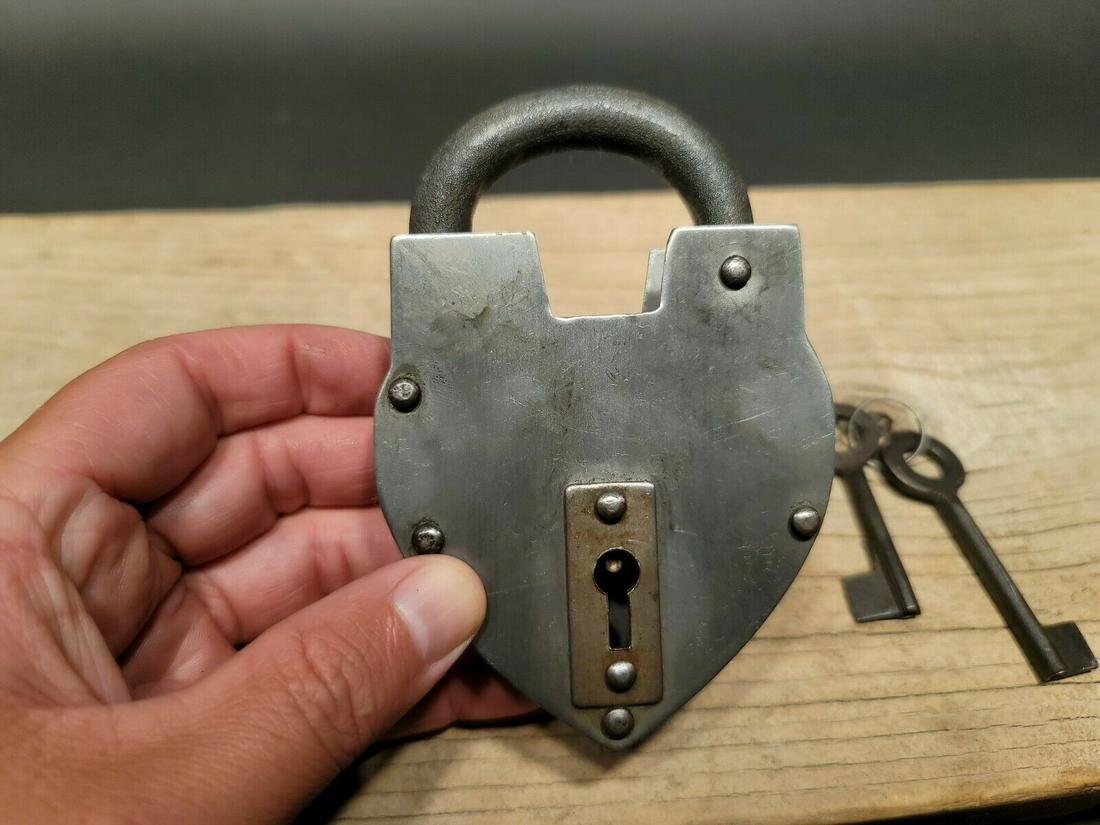 Cast Iron Steel Heart Bridge Padlock Lock & Key: 5" tall x 3 1/4" Wide Nice reproduction heart shaped cast iron and steel padlock! This lock is fully functional! Hard to tell its age. Heavy iron and brass. Great aged patina throughout. Limited quant